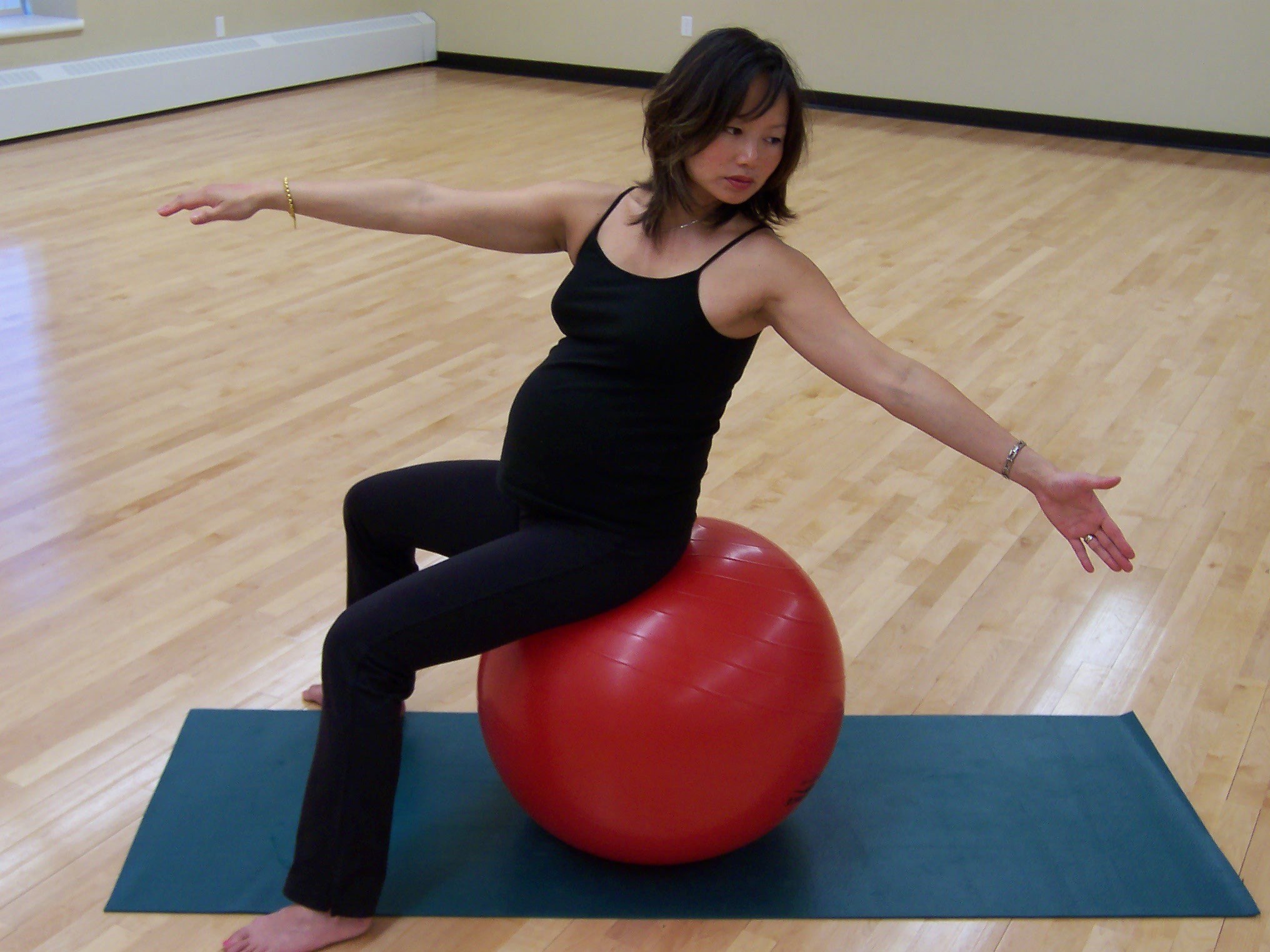 Woman doing excercises with balance ball